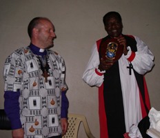 Bishop Alan presents his friend Bishop Taama with a plaque during his last visit to Kajiado in 2009.